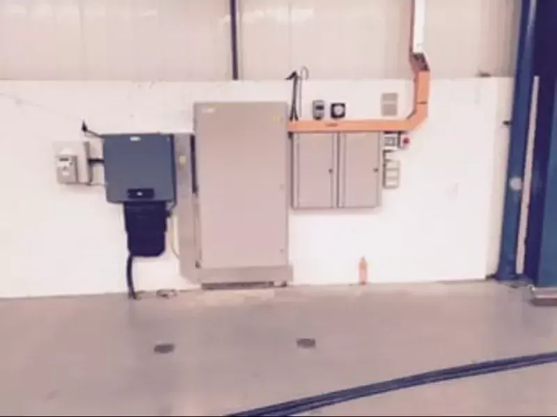 Distribution board and containment installed on a commercial unit wall