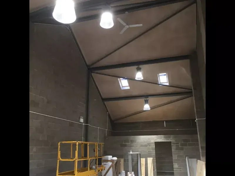 Lighting and emergency fittings installed at high level in a commercial unit